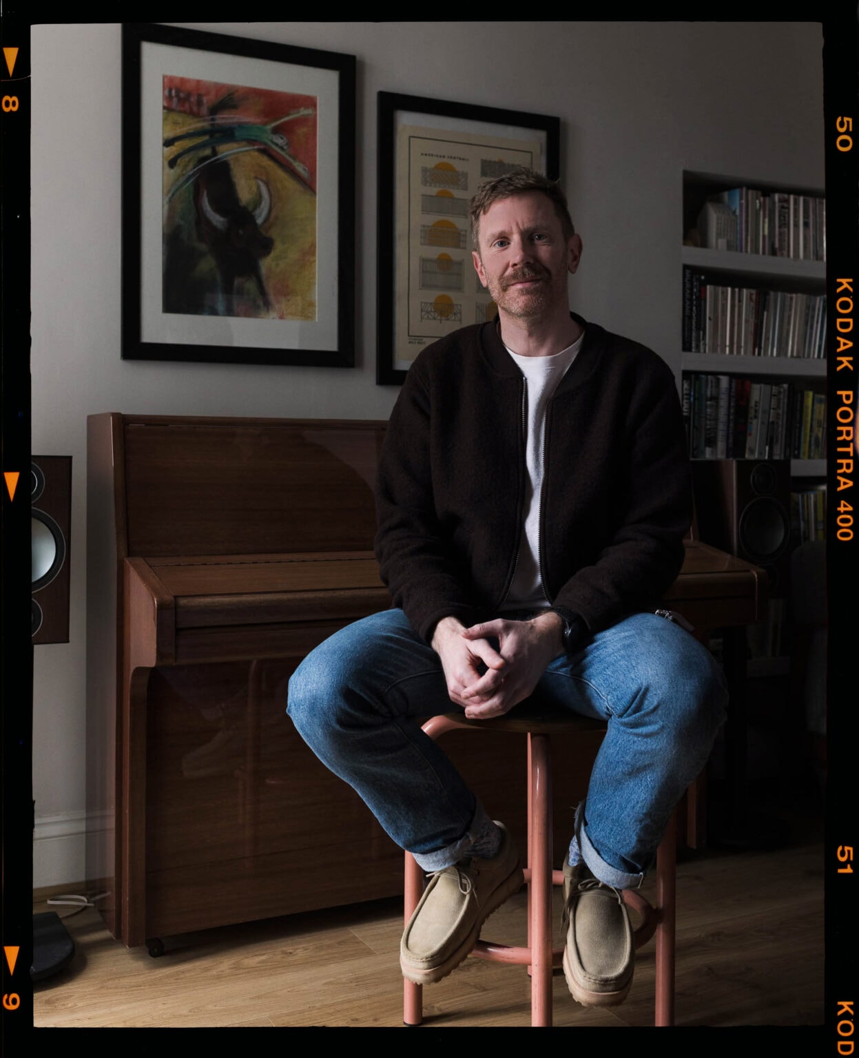 John Wellings, wedding photographer, sitting in a living room